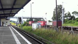 preview picture of video '[MRCE] Dispolok pulling a freight train past Schönfließ station.'