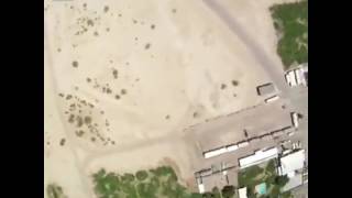 Skydiver lands on slip n slide