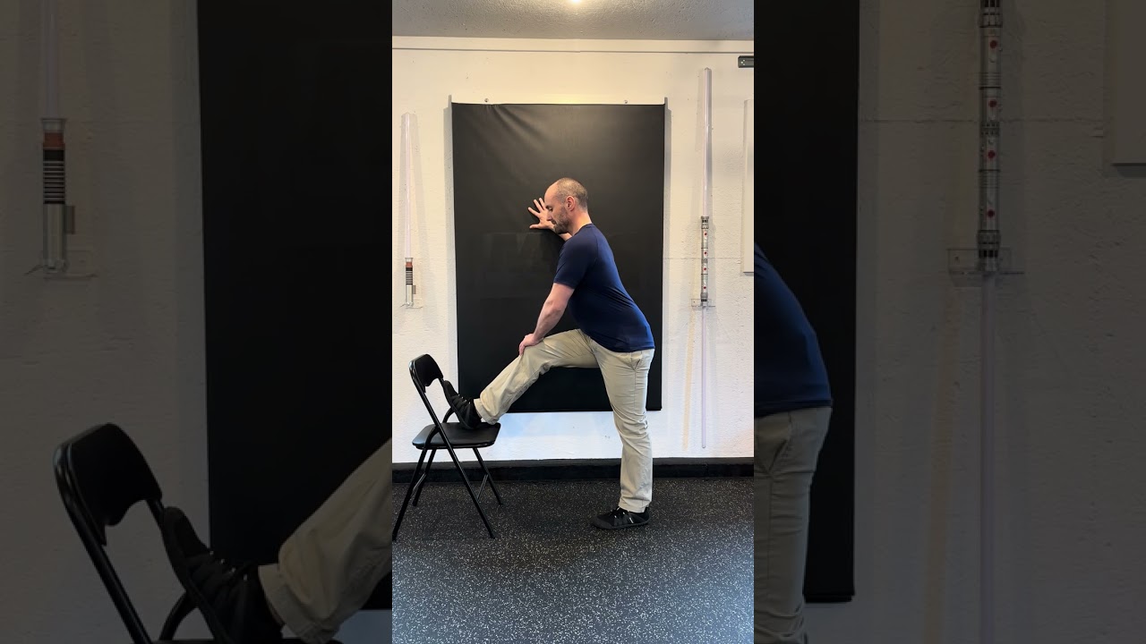 Wall Supported Standing Static Hamstring Stretch