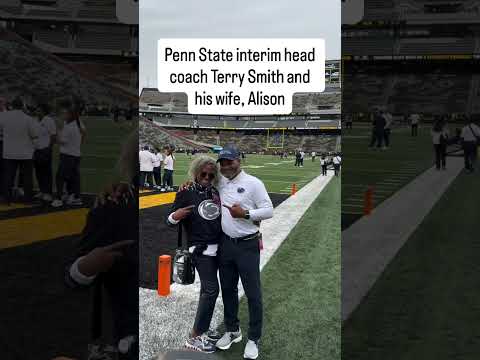 Penn State interim head coach Terry Smith and his wife, Alison pose for a photo before the Iowa game