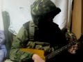 Russian soldier plays the balalaika 