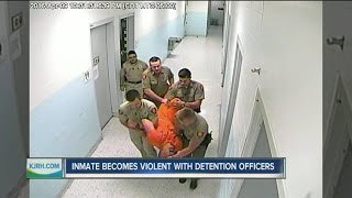 Video shows inmate throwing chair at officers