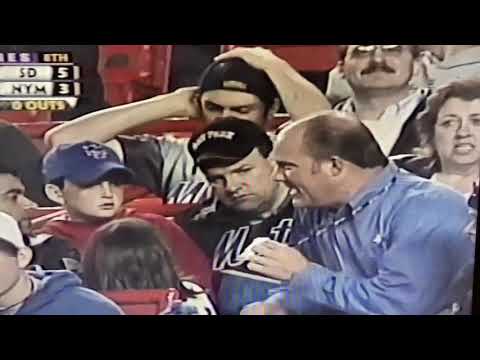 Mark Grant gives baseball to a little girl at Shea Stadium 2002