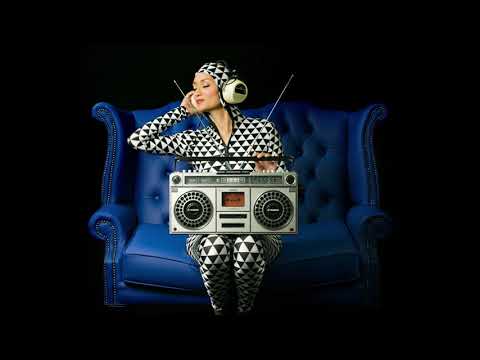 Cute woman in a chair holding a retro ghettoblaster - Disco House Music