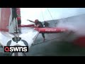 Dramatic moment sailboat crew member goes overboard during Grand Prix race | SWNS