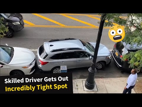 Skilled New York driver expertly maneuver his car out of a tight parking space!