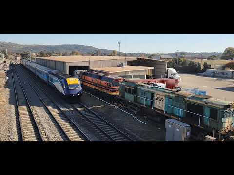 XPT: Power cars XP2017 & XP2011 arriving at & departing Cootamundra station.