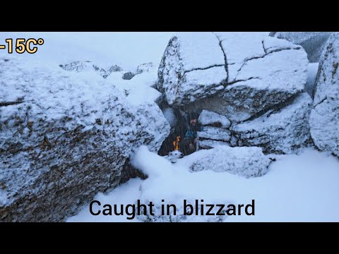 Caught in a deadly winter blizzard.Building a frozen shelter in a snowstorm for survival