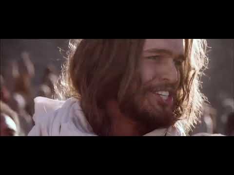 Son of God (2014) official trailer image: Jesus and his disciples framed against desert light
