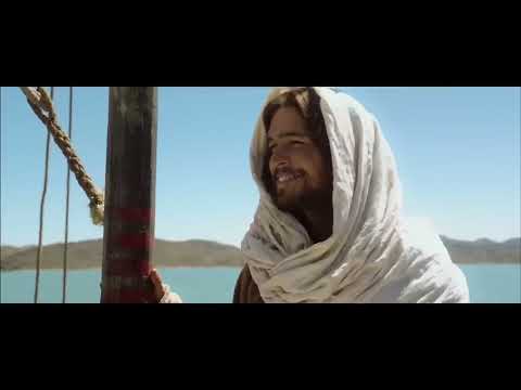 Trailer still: the Last Supper tableau with candle glow and hushed strings