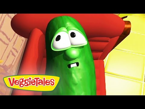 VeggieTales pickle character with wide eyes and a worried expression, sitting in a red chair.