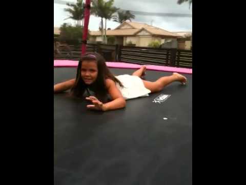 8 year old girl acting like a retart and jumping on the tra