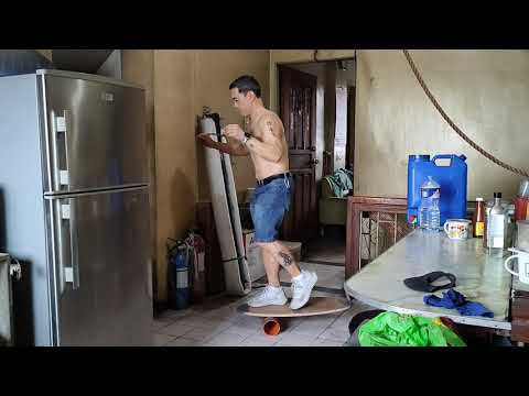 beginner doing "hang ten" balance board