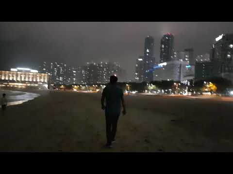 Walking on Haeundae Beach on a summer night