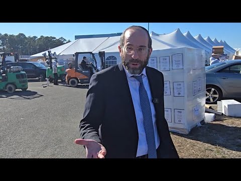 Tomchei Shabbos in action — providing Pesach products to thousands of people, b’derech kavod.