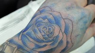 Getting Inked Hand tattoo Blue Rose