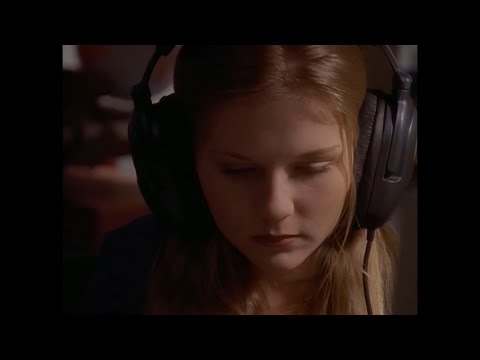 Kirsten Dunst wears huge headphones in The Outer Limits 'Music of the Spheres'