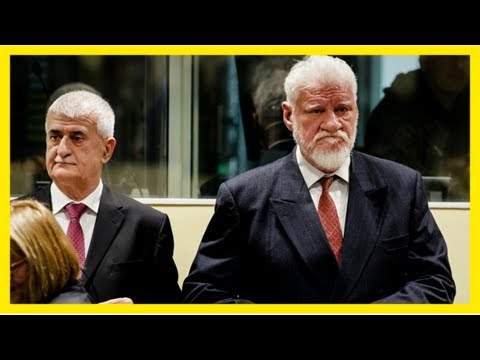 Un war crimes defendant claims to take poison in court