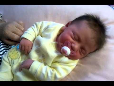 Misha's first atempt at sucking on a dummy...