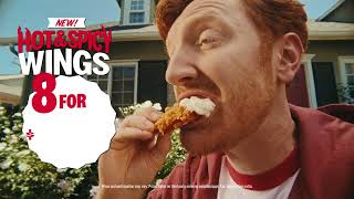  Man dips his chicken in sauce