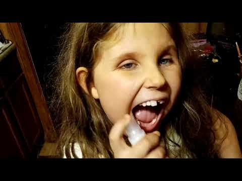 Lexi trying and reviewing the New Warhead Super Sour Spray Candy in watermelon and apple flavor