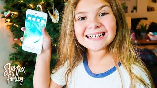 📱9 YEAR OLD GETS iPHONE FOR CHRISTMAS!! 🎅 (Real iPhone) | Slyfox Family