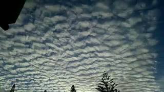 Flat earth wooly clouds at sunset