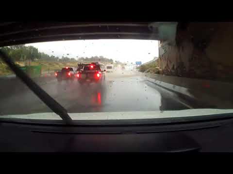 Water Splashes On Car's Windshield From Passerby's Vehicle While Driving On Highway - 1260885