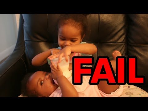 Toddler Tries To Feed and Change Baby Sister
