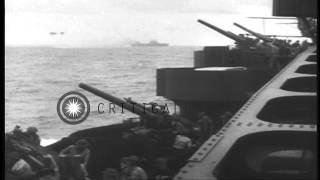 US Navy personnel fire AA guns and USS Lexington (CV-2) underway and hit during B...HD Stock Footage