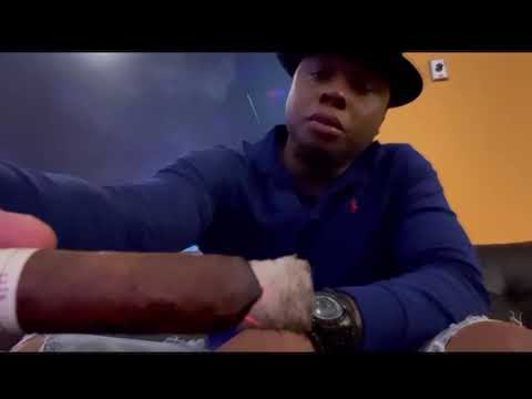 Staffon Smith smoking a “Liga Privada # 9 Robusto”