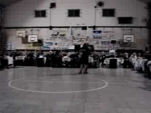  El Chino Perico  and  Cinthia Wilson  are  dancing  to  a  tango