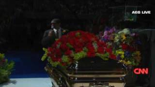 Usher chokes up at memorial