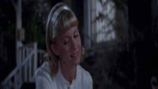 sandy singing in the night hopelessly devoted to you