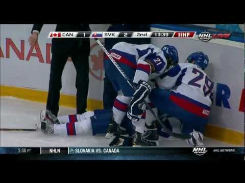 Anthony Camara hits Patrik Luza at the WJC 12/28/12