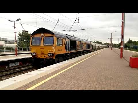 66704 GBRF Powers through Wigan on the WCML Hauling a Castle Cement train