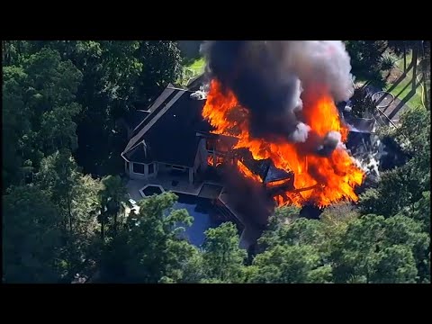 Authorities say a fire that destroyed a 10,000-square-foot mansion near Houston and injured two construction workers. Officials say more than 60 firefighters and medical personnel responded Thursday to the fire. (June 14)