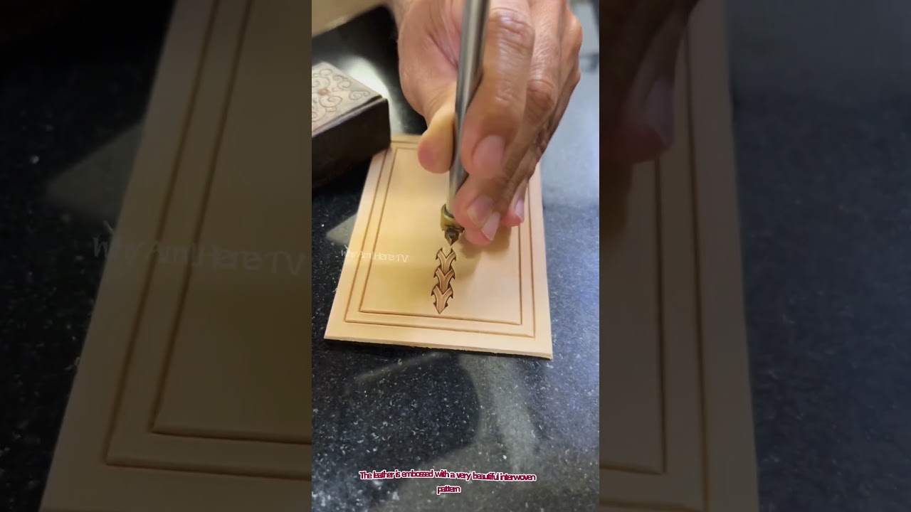 The leather is embossed with a very beautiful interwoven pattern