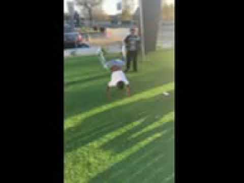 Me doing backflips with my cousin At the park