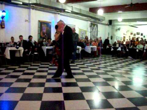  El Chino Perico  and  Aurora Lubiz  are  dancing  to  the  tango  "  Una Emocion  "