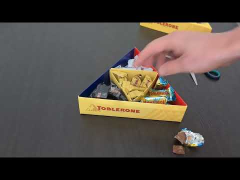 Unboxing Toblerone sweets assortment in triangle box