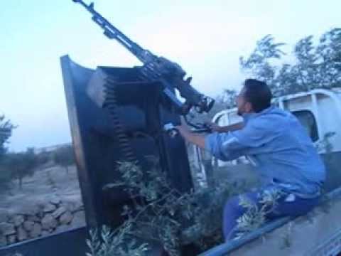 التصدي لطيران النظام برشاش الدوشكا من قبل مقاتلي لواء درع الرحمن