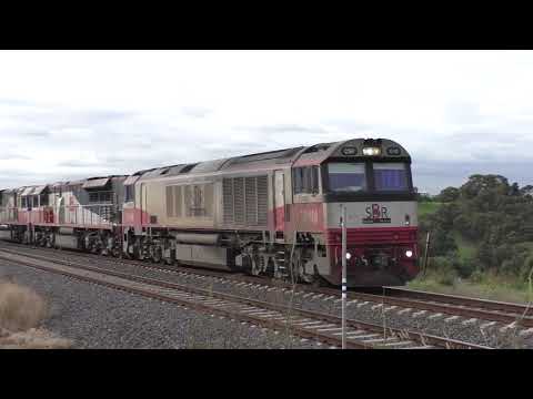 SCT Trains A Lengthy Brisbane to Melbourne Freight BM9 at Airport West
