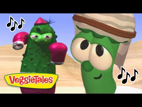 Two green VeggieTales characters wearing boxing gloves boxing in a desert setting, with the VeggieTales logo in the foreground.