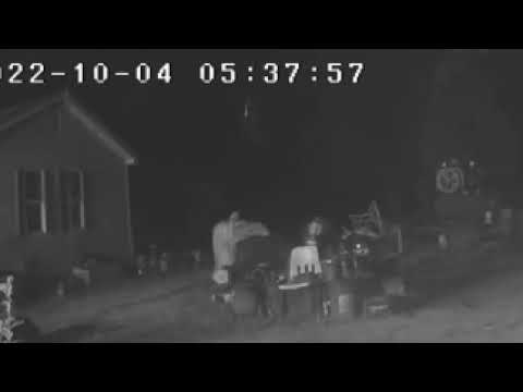 Ghost like Paranormal light dancing in sky over old cemetery in yard