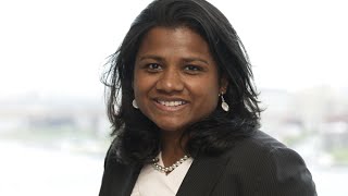 Polio Survivor Thrives At AIG, As Ironman Triathlete