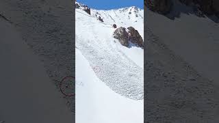 Snowboarder gets caught in massive avalanche