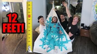 DWARF ATTACHED TO 12-FOOT PAPER AIRPLANE! (will it fly!?)