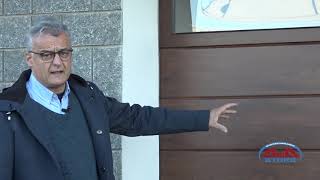 Portone sezionale per garage con porta abbinata