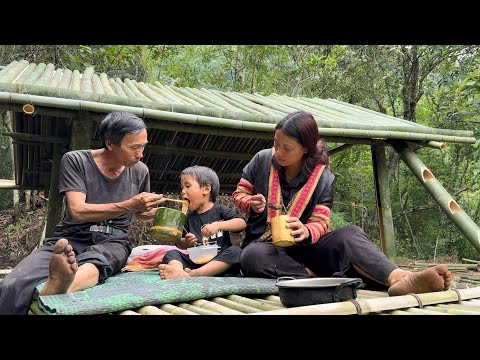 A single mother and her son cut bamboo to build a house. The kind man helped